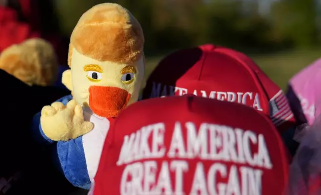 Merchandise is seen outside a Republican presidential nominee former President Donald Trump campaign event at Dane Manufacturing, Tuesday, Oct. 1, 2024, in Waunakee, Wis. (AP Photo/Charlie Neibergall)