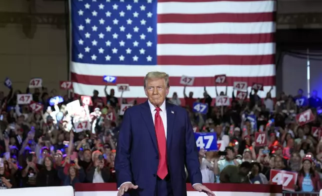 Republican presidential nominee former President Donald Trump arrives for a town hall at Lancaster County Convention Center, Sunday, Oct. 20, 2024, in Lancaster, Pa. (AP Photo/Evan Vucci)