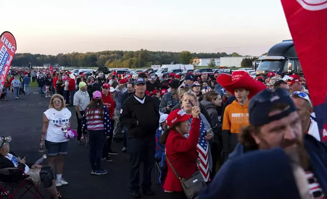 Supporters of Republican presidential nominee former President Donald Trump wait to enter a campaign rally at the Butler Farm Show, Saturday, Oct. 5, 2024, in Butler, Pa. (AP Photo/Julia Demaree Nikhinson)