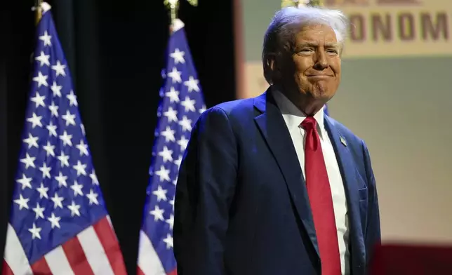 Republican presidential nominee former President Donald Trump arrives to speak at a meeting of the Detroit Economic Club, Thursday, Oct. 10, 2024, in Detroit. (AP Photo/Julia Demaree Nikhinson)