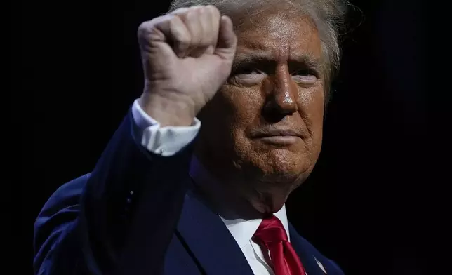 Republican presidential nominee former President Donald Trump departs after speaking at a meeting of the Detroit Economic Club, Thursday, Oct. 10, 2024, in Detroit. (AP Photo/Julia Demaree Nikhinson)