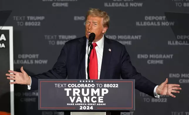 Republican presidential nominee former President Donald Trump speaks at a campaign rally at the Gaylord Rockies Resort and Convention Center Friday, Oct. 11, 2024, in Aurora, Colo. (AP Photo/David Zalubowski)