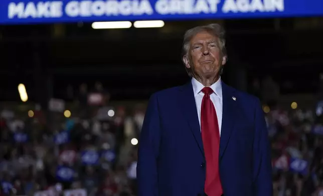 Republican presidential nominee former President Donald Trump arrives at a campaign rally at McCamish Pavilion Monday, Oct. 28, 2024, in Atlanta, Ga. (AP Photo/Julia Demaree Nikhinson)