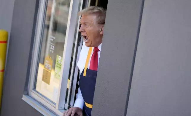 Republican presidential nominee former President Donald Trump speaks while standing at a drive-thru window during a campaign stop at a McDonald's, Sunday, Oct. 20, 2024, in Feasterville-Trevose, Pa. (AP Photo/Evan Vucci)