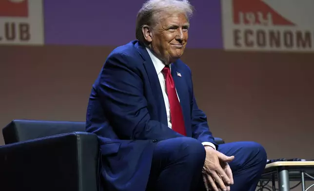 Republican presidential nominee former President Donald Trump listens as he answers questions at a meeting of the Detroit Economic Club, Thursday, Oct. 10, 2024, in Detroit. (AP Photo/Julia Demaree Nikhinson)