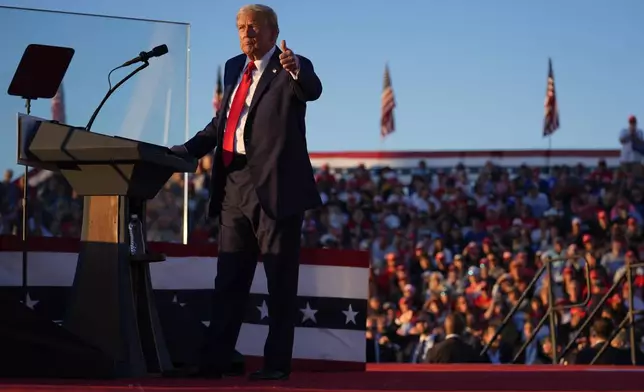 Republican presidential nominee former President Donald Trump gestures at a campaign rally at the Butler Farm Show, Saturday, Oct. 5, 2024, in Butler, Pa. (AP Photo/Evan Vucci)