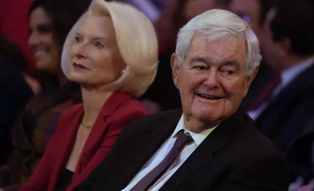 Newt Gingrich and his wife Callista arrive before Republican presidential nominee former President Donald Trump at a campaign rally at Madison Square Garden, Sunday, Oct. 27, 2024, in New York. (AP Photo/Alex Brandon)