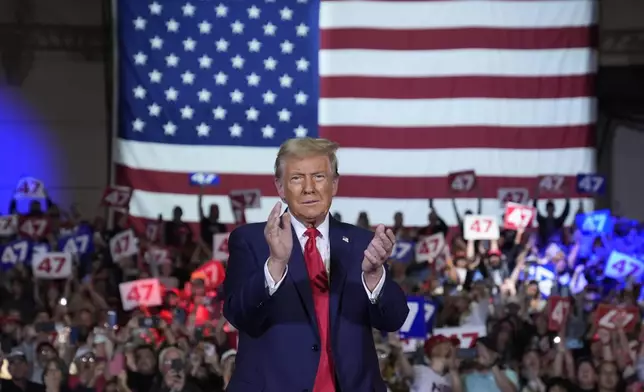 Republican presidential nominee former President Donald Trump arrives for a town hall at Lancaster County Convention Center, Sunday, Oct. 20, 2024, in Lancaster, Pa. (AP Photo/Evan Vucci)