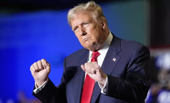 Republican presidential nominee former President Donald Trump dances at a campaign rally at Greensboro Coliseum, Tuesday, Oct. 22, 2024, in Greensboro, N.C. (AP Photo/Alex Brandon)