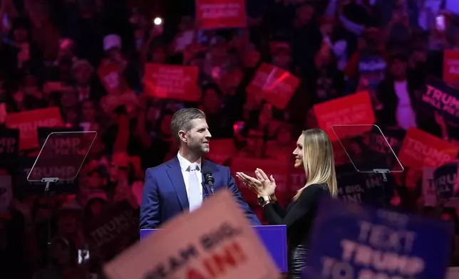 Eric Trump, left, and Republican National Committee co-chair Lara Trump speak at a campaign rally for Republican presidential nominee former President Donald Trump at Madison Square Garden, Sunday, Oct. 27, 2024, in New York. (AP Photo/Julia Demaree Nikhinson)