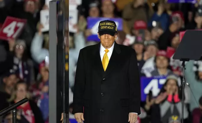 Republican presidential nominee former President Donald Trump on stage at a campaign event Friday, Oct. 25, 2024, in Traverse City, Mich. (AP Photo/Paul Sancya)