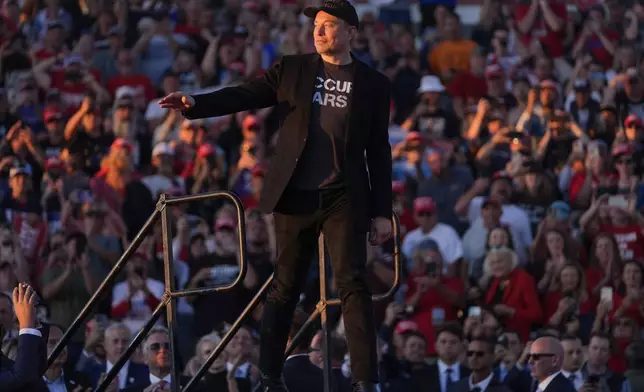 Elon Musk walks onto stage as Republican presidential nominee former President Donald Trump speaks at a campaign rally at the Butler Farm Show, Saturday, Oct. 5, 2024, in Butler, Pa. (AP Photo/Evan Vucci)