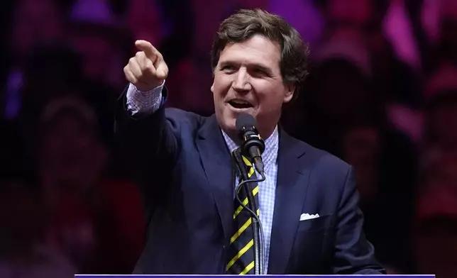 Tucker Carlson speaks before Republican presidential nominee former President Donald Trump at a campaign rally at Madison Square Garden, Sunday, Oct. 27, 2024, in New York. (AP Photo/Evan Vucci)