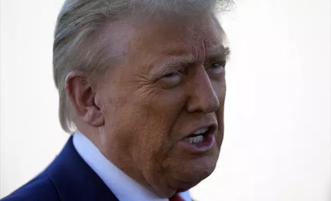 Republican presidential nominee former President Donald Trump talks with reporters as he arrives at Harrisburg International Airport, Sunday, Oct. 20, 2024, in Harrisburg, Pa. (AP Photo/Evan Vucci)