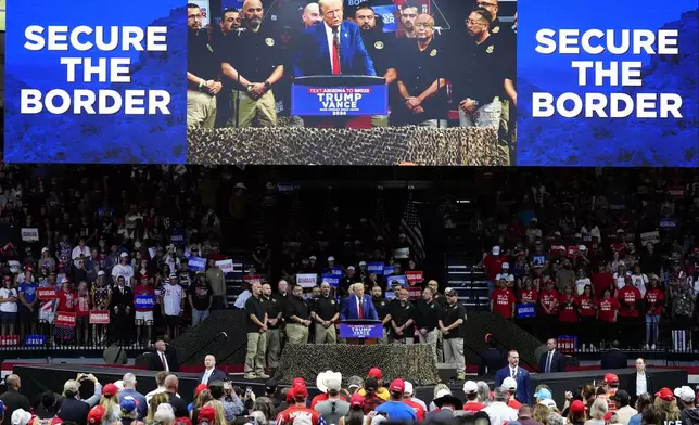 Republican presidential nominee former President Donald Trump speaks at a campaign rally at the Findlay Toyota Arena Sunday, Oct. 13, 2024, in Prescott Valley, Ariz. (AP Photo/Ross Franklin)