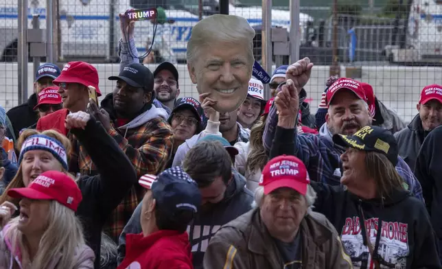 Supporters of Republican presidential nominee former President Donald Trump gather for his campaign rally outside Madison Square Garden, Sunday, Oct. 27, 2024, in New York. (AP Photo/Yuki Iwamura)