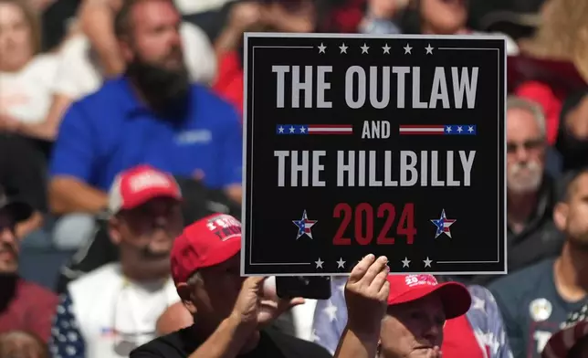 Supporters arrive before Republican presidential nominee former President Donald Trump speaks at a Turning Point Action campaign rally, Wednesday, Oct. 23, 2024, in Duluth, Ga. (AP Photo/Alex Brandon)