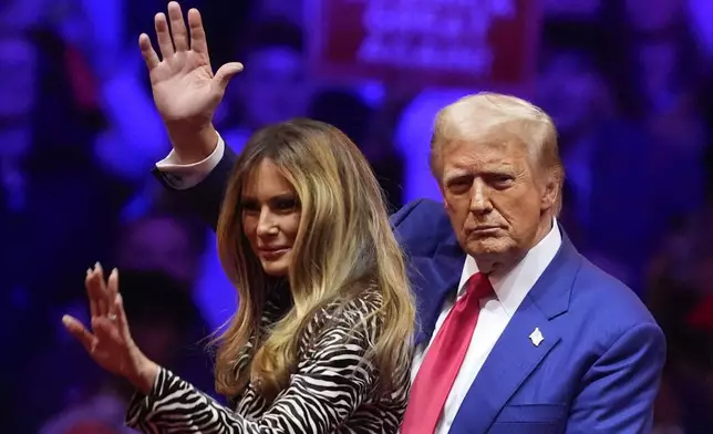 Republican presidential nominee former President Donald Trump and former first lady Melania Trump wave at a campaign rally at Madison Square Garden, Sunday, Oct. 27, 2024, in New York. (AP Photo/Evan Vucci)