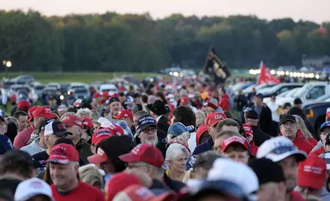 Supporters wait in line before Republican presidential nominee former President Donald Trump speaks at a campaign rally at the Butler Farm Show, the site where a gunman tried to assassinate him in July, Saturday, Oct. 5, 2024, in Butler, Pa. (AP Photo/Alex Brandon)