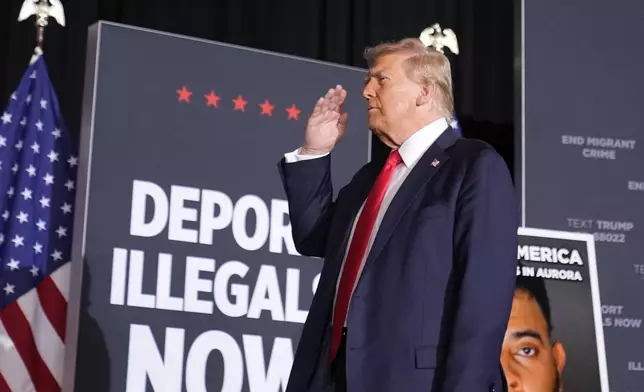 Republican presidential nominee former President Donald Trump salutes at a campaign rally at the Gaylord Rockies Resort &amp; Convention Center, Friday, Oct. 11, 2024, in Aurora, Colo. (AP Photo/Alex Brandon)