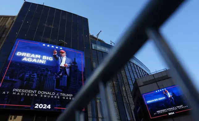 Video boards outside Madison Square Garden display information about the campaign rally for Republican presidential nominee former President Donald Trump Sunday, Oct. 27, 2024, in New York. (AP Photo/Julia Demaree Nikhinson)