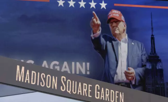 Video boards display information about the campaign rally for Republican presidential nominee former President Donald Trump outside Madison Square Garden, Sunday, Oct. 27, 2024, in New York. (AP Photo/Yuki Iwamura)