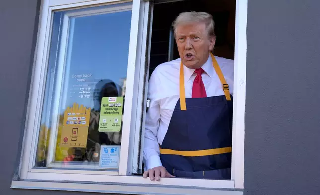 Republican presidential nominee former President Donald Trump speaks from a drive-thru window during a campaign stop at a McDonald's, Sunday, Oct. 20, 2024, in Feasterville-Trevose, Pa. (AP Photo/Evan Vucci)