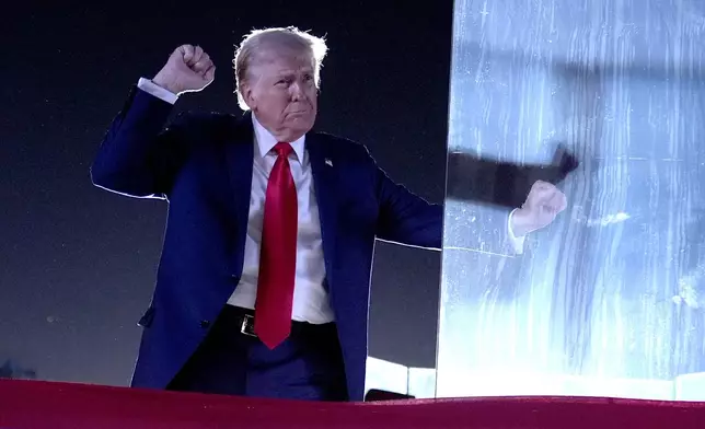 Republican presidential nominee former President Donald Trump dances as he departs after speaking at a campaign event at the Butler Farm Show, Saturday, Oct. 5, 2024, in Butler, Pa. (AP Photo/Alex Brandon)