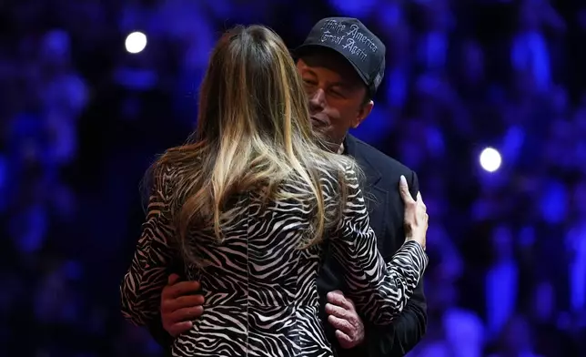 Elon Musk, right, greets former first lady Melania Trump on stage during a campaign rally for Republican presidential nominee former President Donald Trump at Madison Square Garden, Sunday, Oct. 27, 2024, in New York. (AP Photo/Julia Demaree Nikhinson)