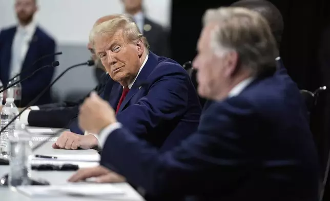 Republican presidential nominee former President Donald Trump listens at a campaign roundtable, Friday, Oct. 18, 2024, in Auburn Hills, Mich. (AP Photo/Evan Vucci)