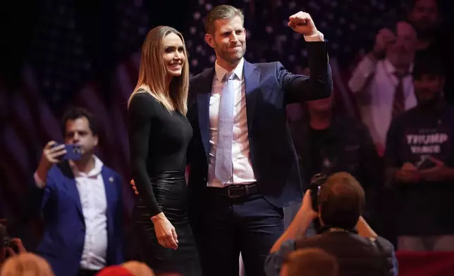 Eric Trump and his wife Lara, arrive before Republican presidential nominee former President Donald Trump at a campaign rally at Madison Square Garden, Sunday, Oct. 27, 2024, in New York. (AP Photo/Evan Vucci)