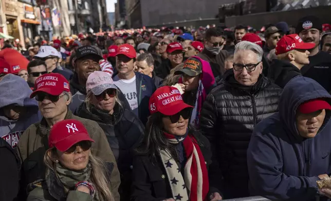 Supporters of Republican presidential nominee former President Donald Trump gather for his campaign rally outside Madison Square Garden, Sunday, Oct. 27, 2024, in New York. (AP Photo/Yuki Iwamura)