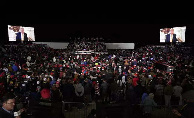 A video message from Republican presidential nominee former President Donald Trump is played at a campaign event Friday, Oct. 25, 2024, in Traverse City, Mich. (AP Photo/Paul Sancya)