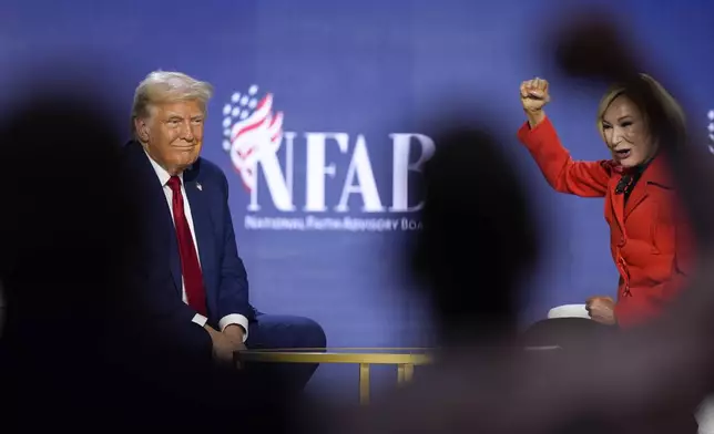 Republican presidential nominee former President Donald Trump speaks with Pastor Paula White during the National Faith Summit at Worship With Wonders Church, Monday, Oct. 28, 2024, in Powder Springs, Ga. (AP Photo/Brynn Anderson)