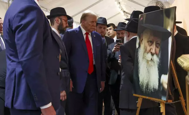 Republican presidential nominee former President Donald Trump arrives at Ohel Chabad-Lubavitch to visit the gravesite of Rabbi Menachem Mendel Schneerson, Monday, Oct. 7, 2024, in New York. (AP Photo/Yuki Iwamura)