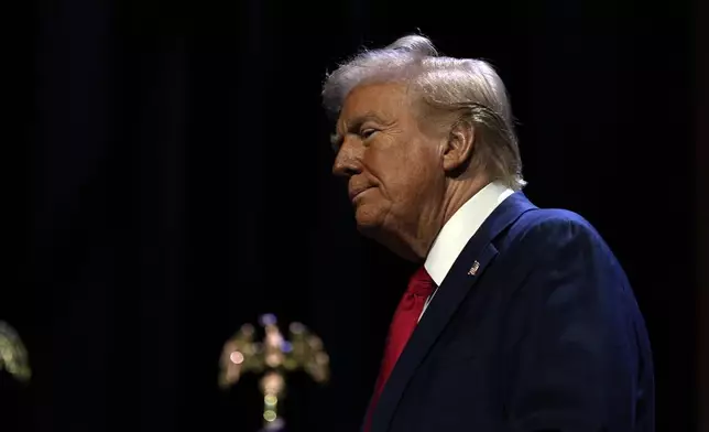 Republican presidential nominee former President Donald Trump arrives to speak at a meeting of the Detroit Economic Club, Thursday, Oct. 10, 2024, in Detroit. (AP Photo/Julia Demaree Nikhinson)