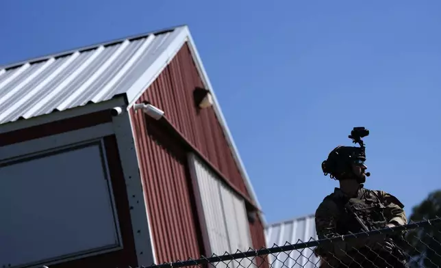 Law enforcement monitors the site before Republican presidential nominee former President Donald Trump speaks at a campaign rally at the Butler Farm Show, Saturday, Oct. 5, 2024, in Butler, Pa. (AP Photo/Julia Demaree Nikhinson)