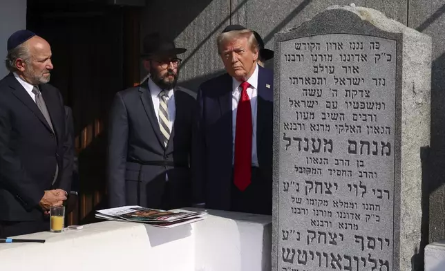 Republican presidential nominee former President Donald Trump visits the gravesite of Rabbi Menachem Mendel Schneerson at Ohel Chabad-Lubavitch, Monday, Oct. 7, 2024, in New York. (AP Photo/Yuki Iwamura)