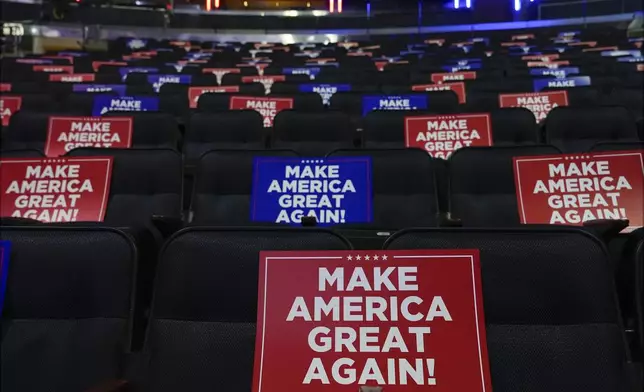 Signs are placed in seats before Republican presidential nominee former President Donald Trump speaks at a campaign rally at Madison Square Garden, Sunday, Oct. 27, 2024, in New York. (AP Photo/Julia Demaree Nikhinson)