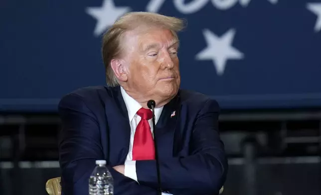 Republican presidential nominee former President Donald Trump listens at a campaign event at Beauty Society, Saturday, Oct. 12, 2024, in North Las Vegas, Nev. (AP Photo/John Locher)