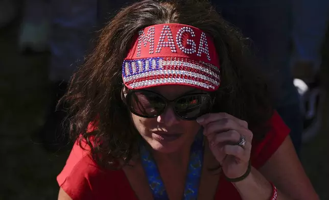 A supporter arrives before Republican presidential nominee former President Donald Trump speaks at a campaign rally at the Butler Farm Show, Saturday, Oct. 5, 2024, in Butler, Pa. (AP Photo/Julia Demaree Nikhinson)