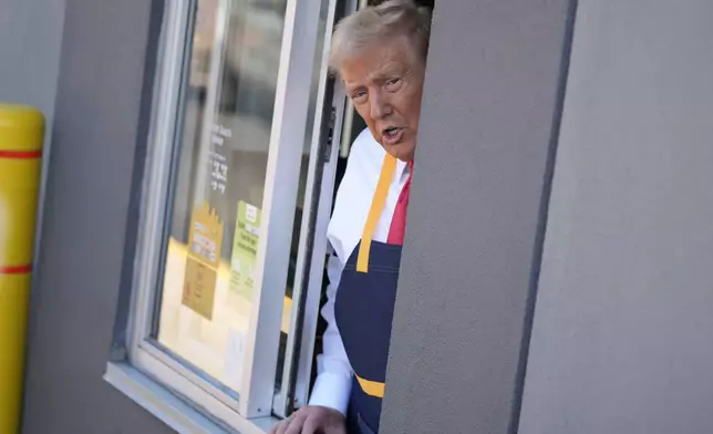 Republican presidential nominee former President Donald Trump speaks from a drive-thru window during a campaign stop at a McDonald's, Sunday, Oct. 20, 2024, in Feasterville-Trevose, Pa. (AP Photo/Evan Vucci)