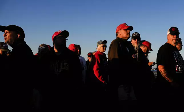 Supporters of Republican presidential nominee former President Donald Trump wait to enter a campaign rally at the Butler Farm Show, Saturday, Oct. 5, 2024, in Butler, Pa. (AP Photo/Julia Demaree Nikhinson)