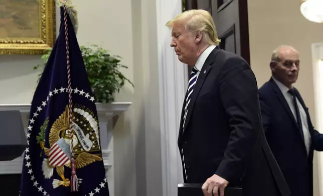 FILE - President Donald Trump walks in to the Roosevelt Room of the White House in Washington, Nov. 1, 2018. Chief of Staff John Kelly is at right. (AP Photo/Susan Walsh, File)