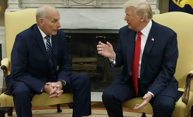 FILE - President Donald Trump talks with White House Chief of Staff John Kelly after he was privately sworn in during a ceremony in the Oval Office in Washington, July 31, 2017. (AP Photo/Evan Vucci, File)