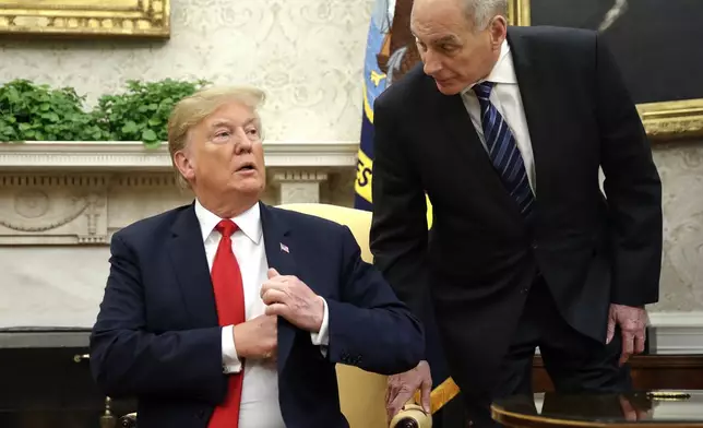 FILE - White House Chief of Staff John Kelly, right, leans in to talk with President Donald Trump in the Oval Office of the White House in Washington, June 27, 2018. (AP Photo/Pablo Martinez Monsivais, File)