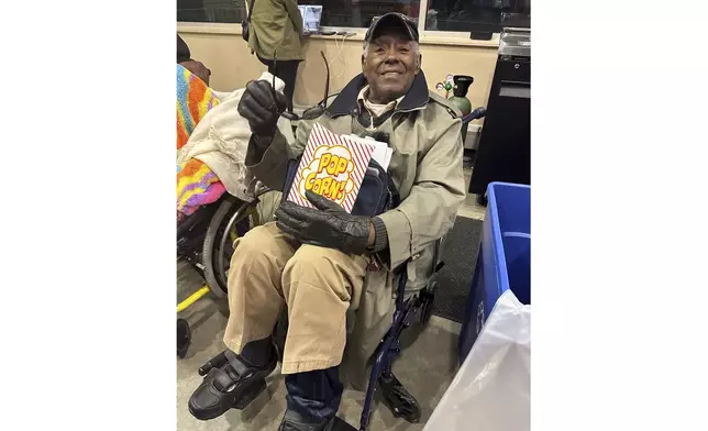 Luther Manus, 97, leaves the Erie Insurance Arena after hearing Democratic presidential candidate Vice President Kamala Harris speak at a rally on Monday, Oct. 14, 2024, in Erie, Pa. (AP Photo/Carolyn Thompson)