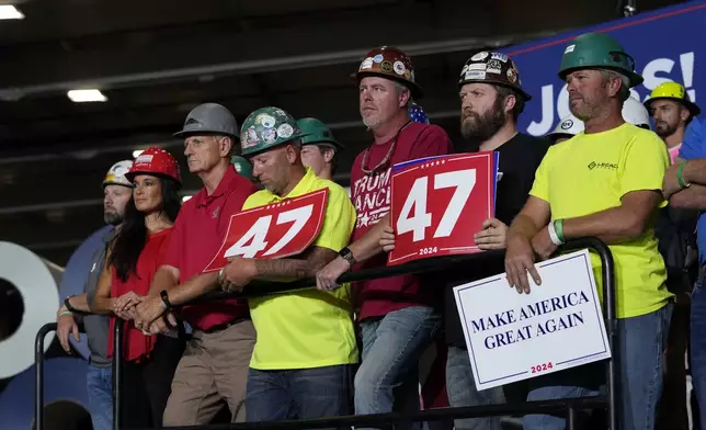 FILE - People arrive before Republican presidential nominee former President Donald Trump speaks at a campaign event, Sept. 27, 2024 in Walker, Mich. (AP Photo/Carlos Osorio, File)