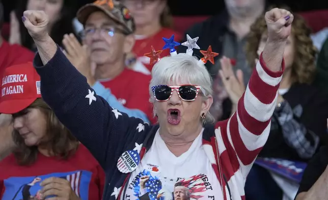 Supporters arrive before Republican vice presidential nominee Sen. JD Vance, R-Ohio speaks at a campaign event Eastern Market Tuesday, Oct. 8, 2024, in Detroit. (AP Photo/Paul Sancya)