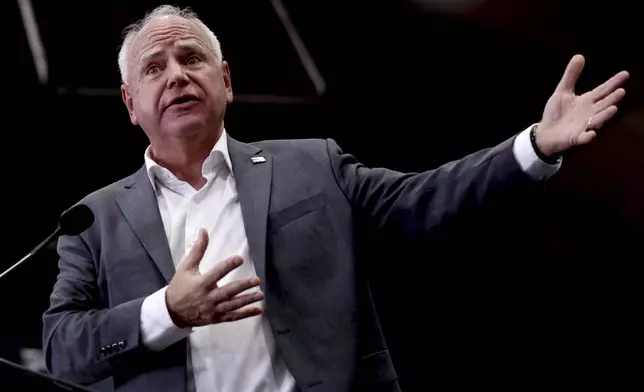 Democratic vice presidential candidate Minnesota Gov. Tim Walz speaks to the crowd during an early voting rally at Palo Verde High School in Tucson, Ariz., Wednesday, Oct. 9, 2024. (Kelly Presnell/Arizona Daily Star via AP)